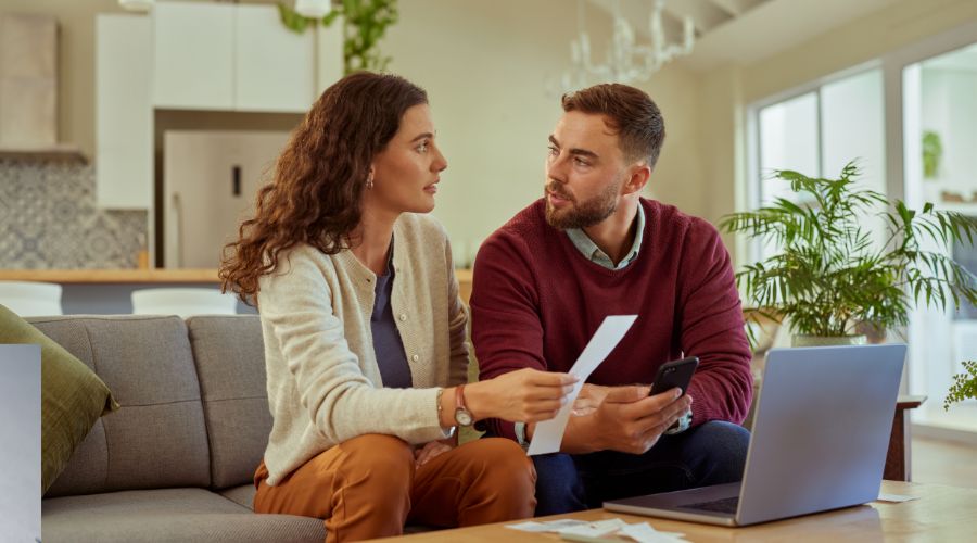 Cohabiting couple in Ireland reviewing life assurance documents